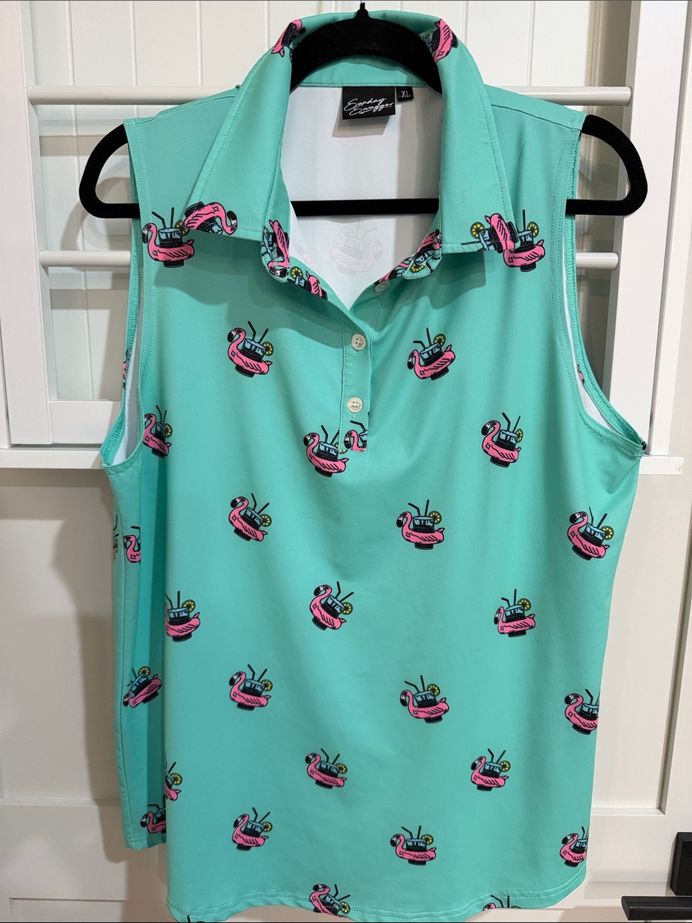 Sleeveless Mint Green Polo Tank with Pink Flamingo Float Motif. Great for golf